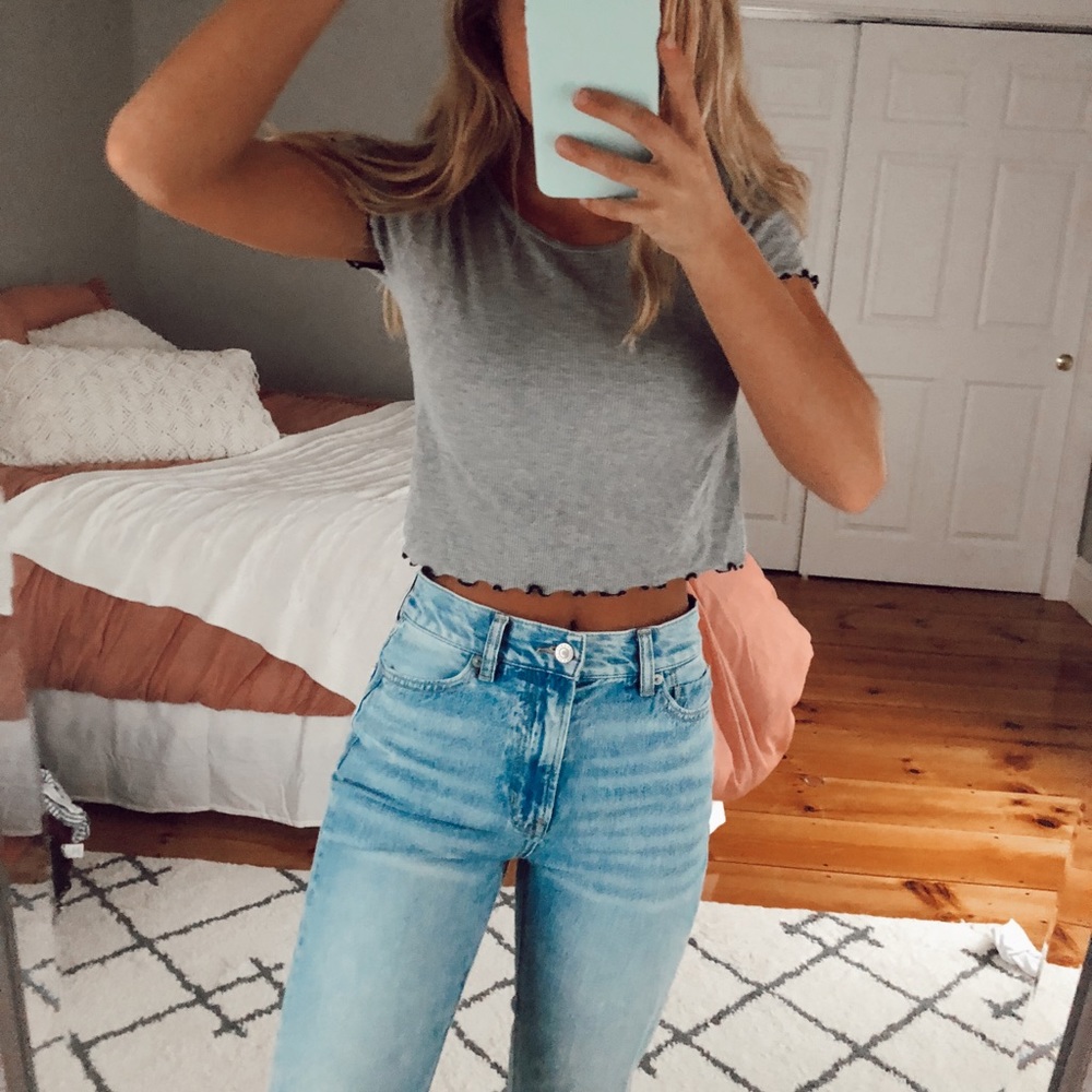 Grey teeshirt with black ruffle details